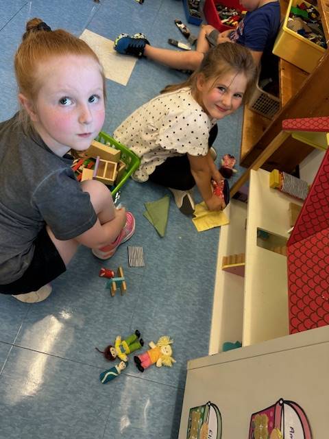 2 students playing with toys