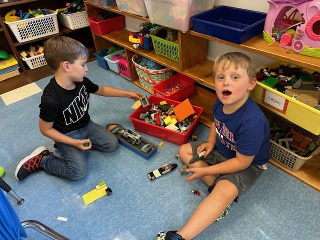 2 students playing with leagues