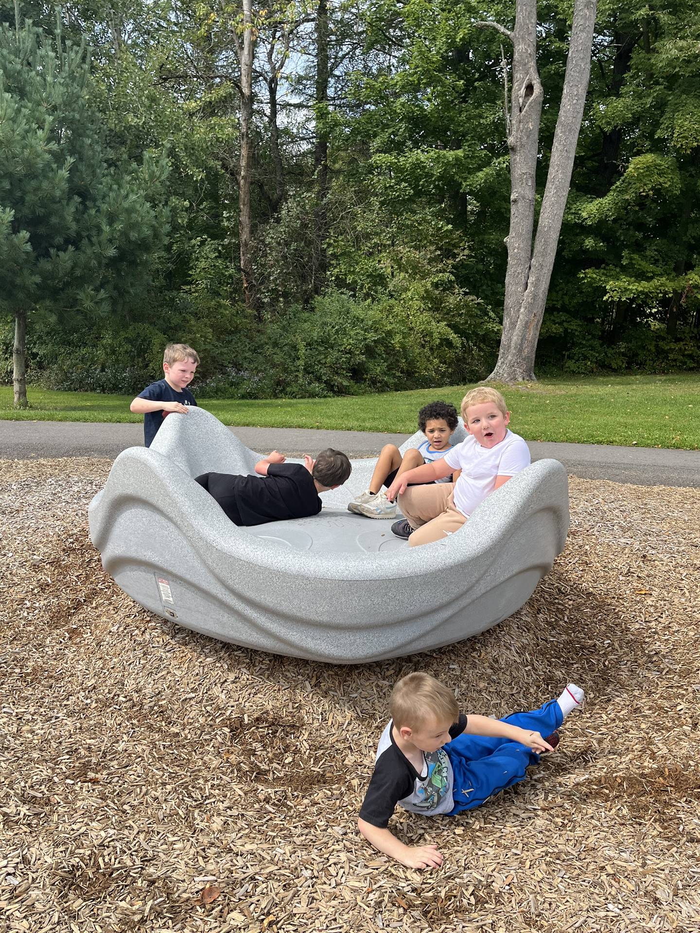 students in playground structure.