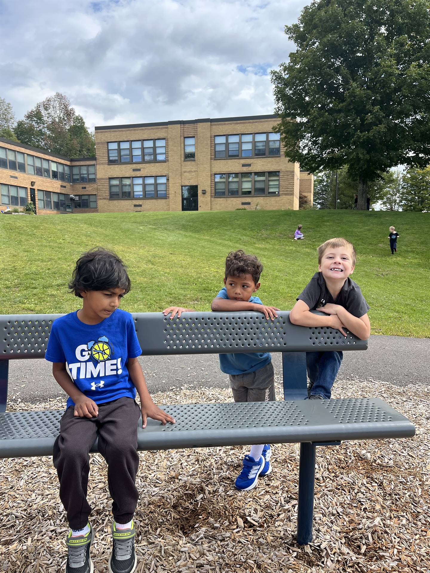 3 students on a bench