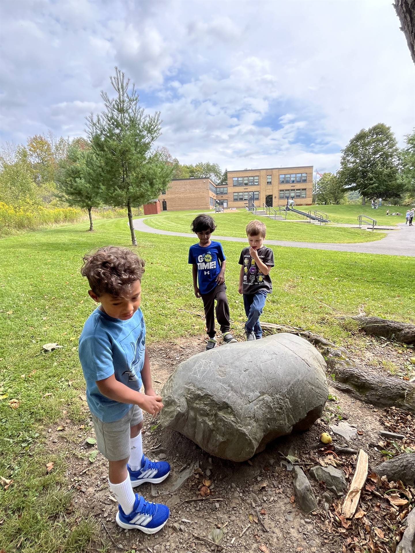 3 students finding a large rock!