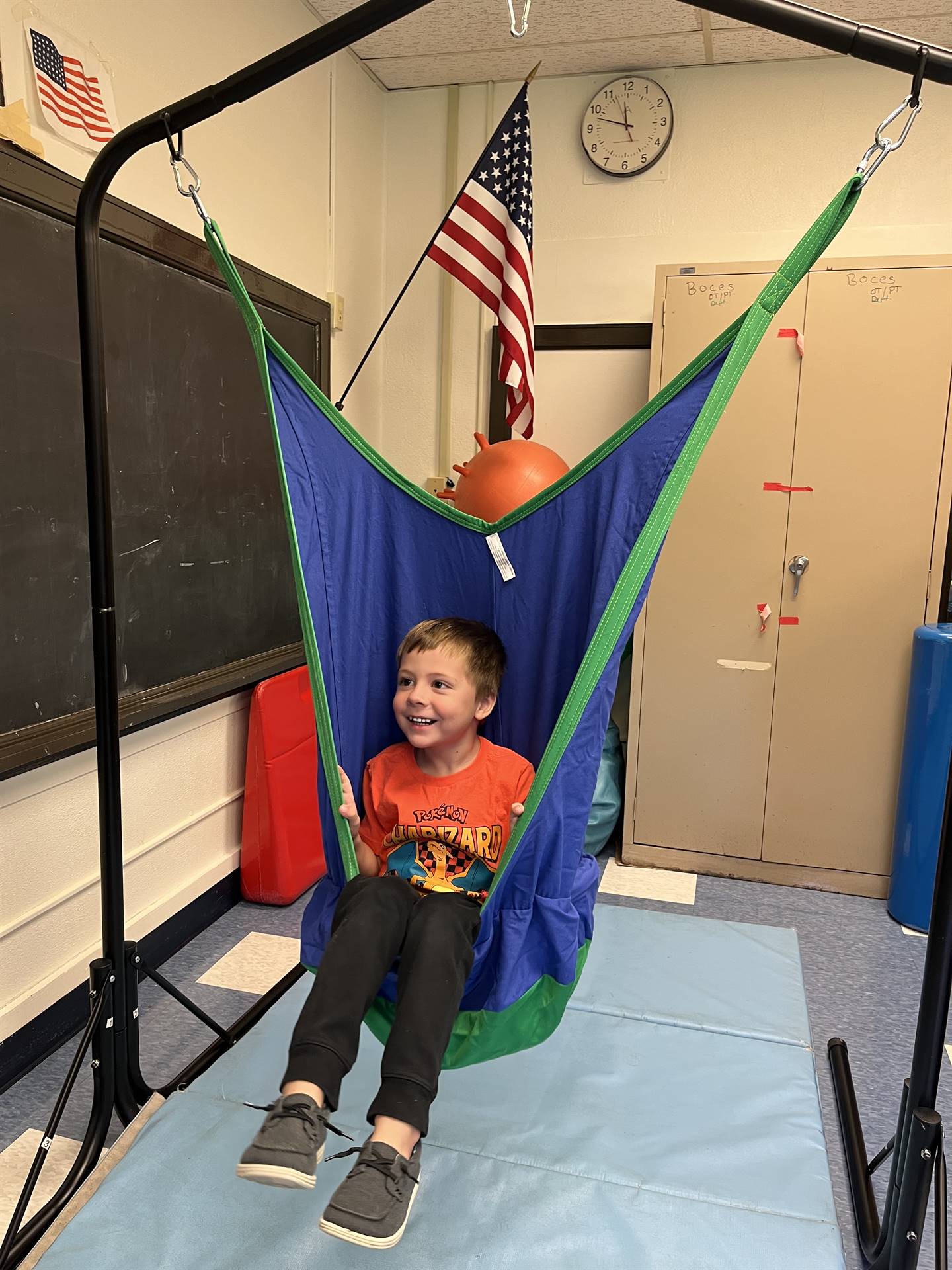student in a sack swing