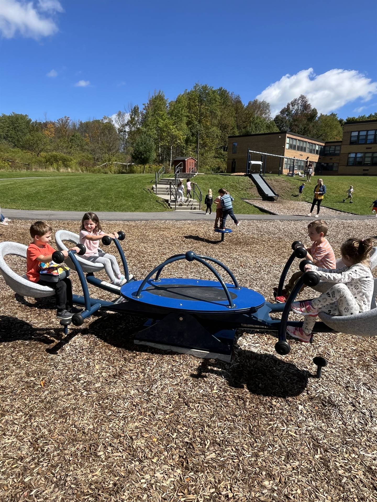 students on a teeter totter structure
