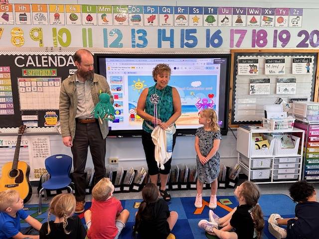 2 adults presenting to students