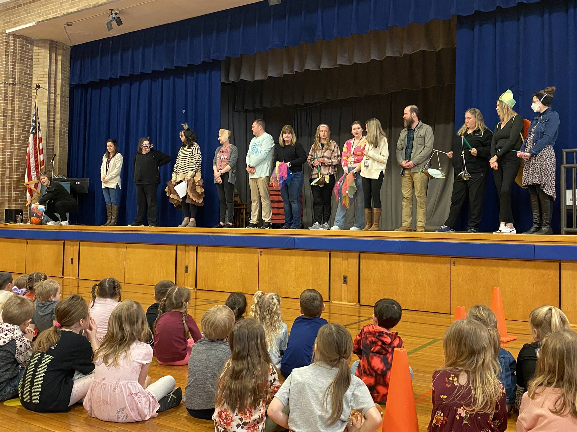 The staff on stage responding to questions and comments from students