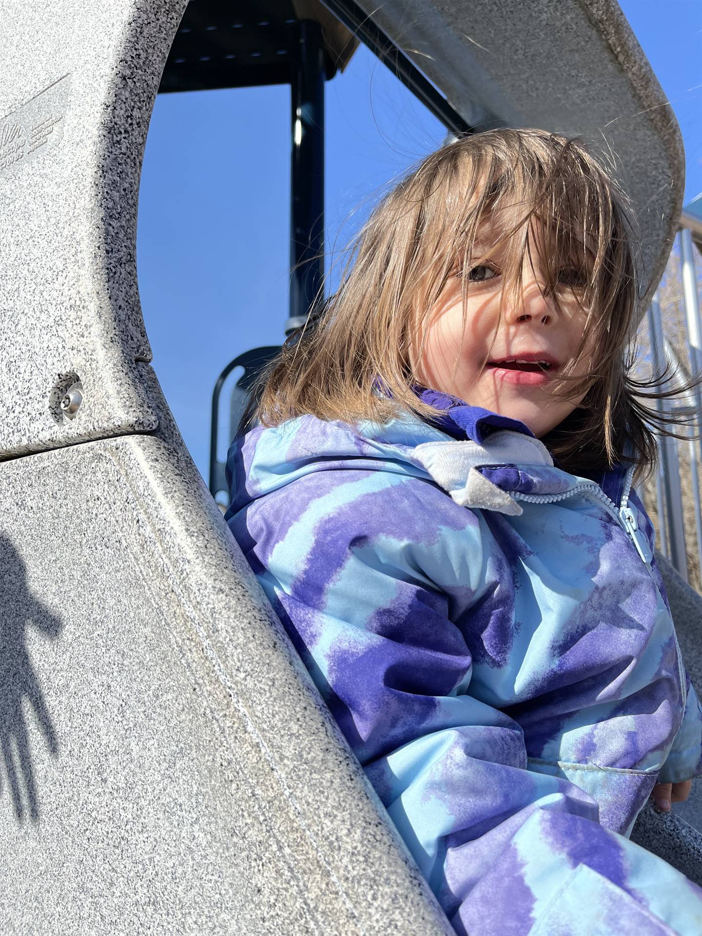 a student on a slide.